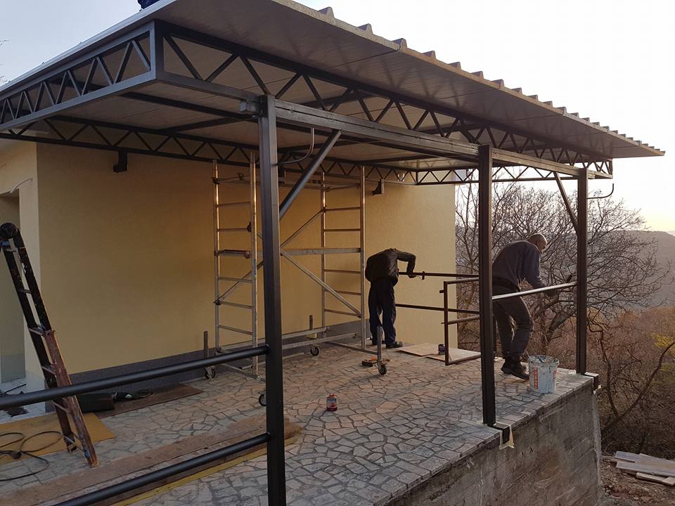 Workers putting awning