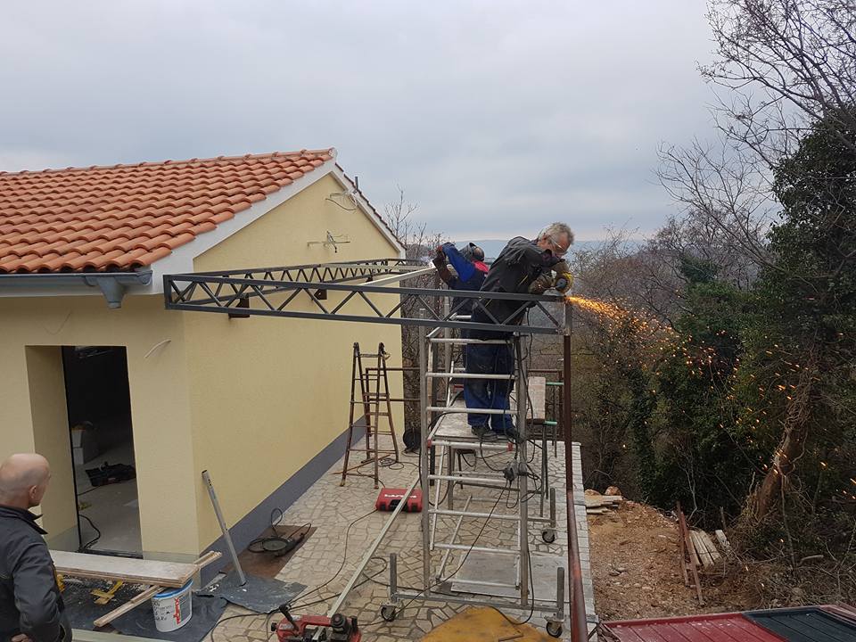 Workers building the awning