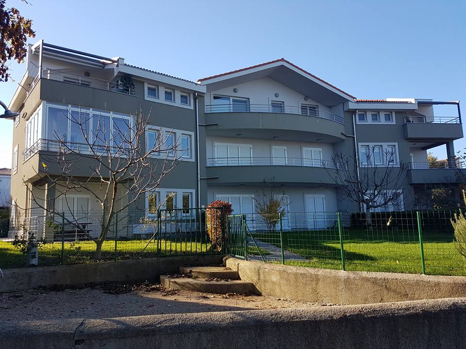 House with wire fence