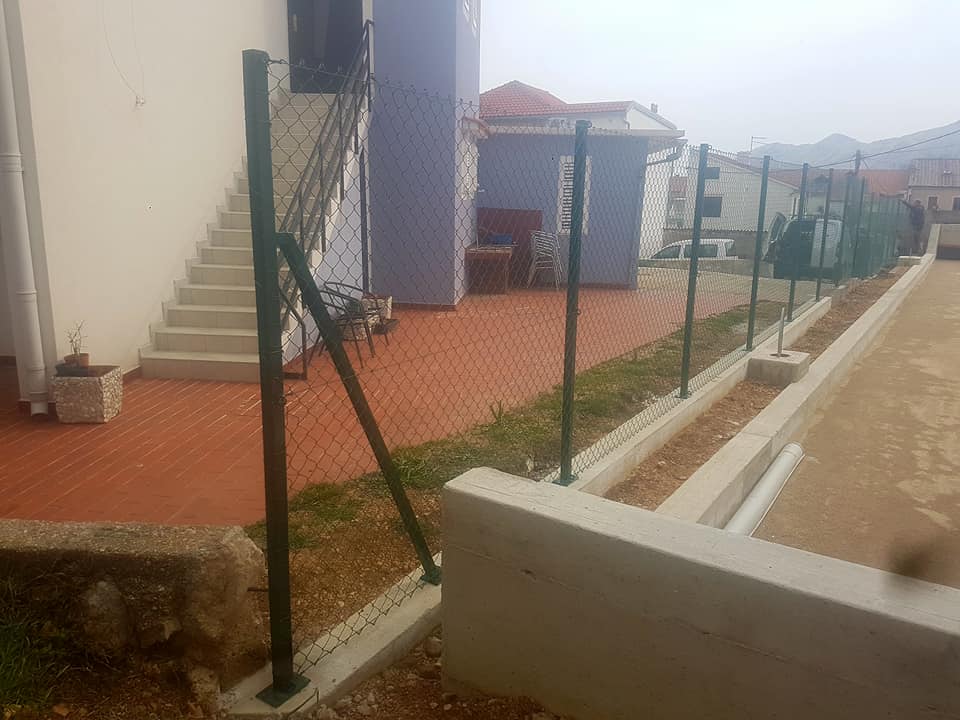 Wire fence apartment complex